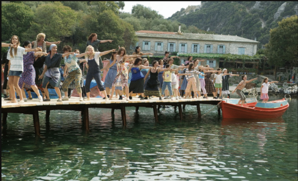 Cast of Mamma Mia performing Dancing Queen by the sea
